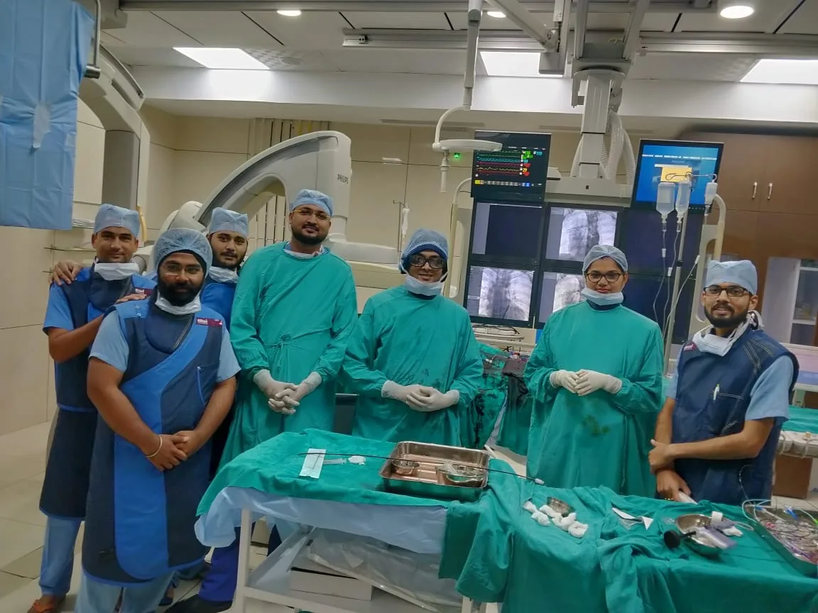Cath lab team after an interventional cardiac procedure
